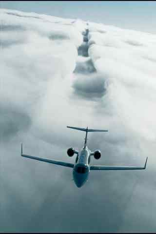 划过云层的飞机壮观风景手机壁纸