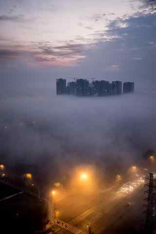 雾中的城市灯光风景手机壁纸