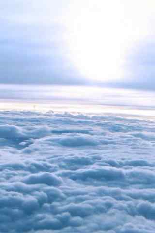 美丽飞机上的云海手机壁纸