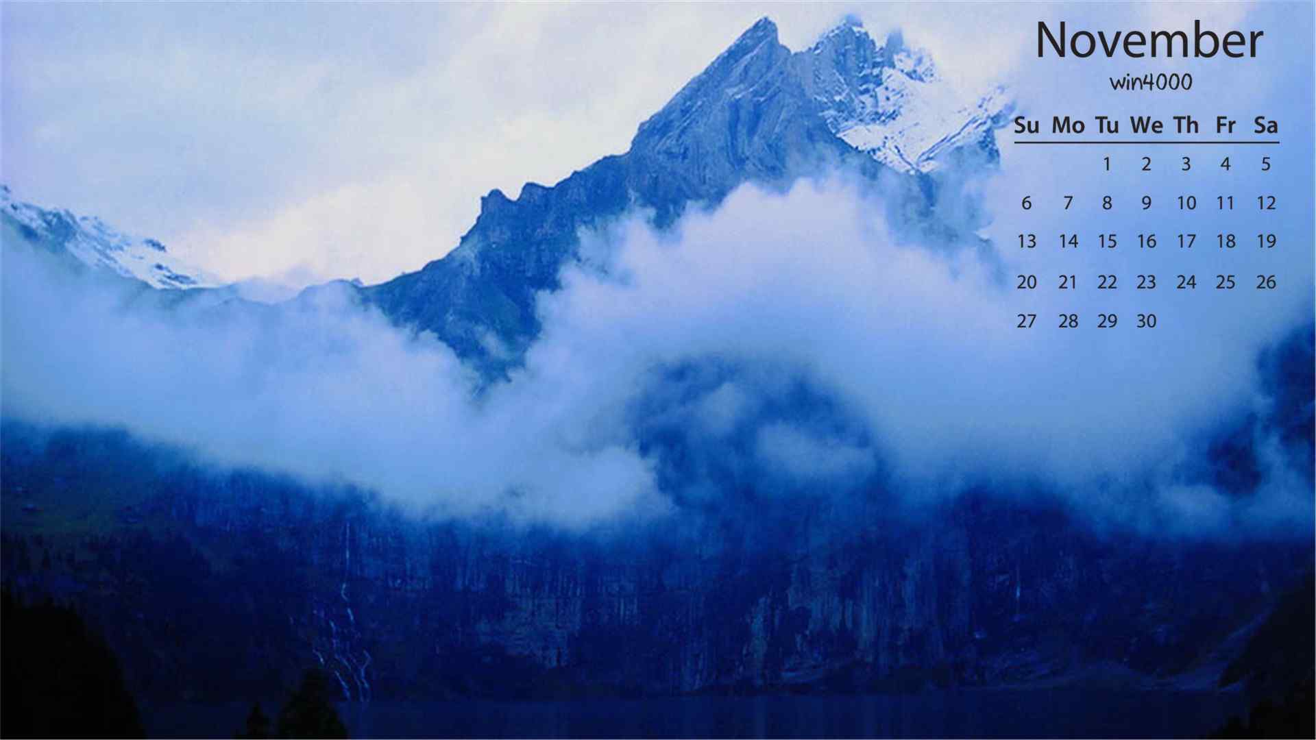 2016年11月日历云雾中的瑞士阿尔卑斯山风景图片壁纸