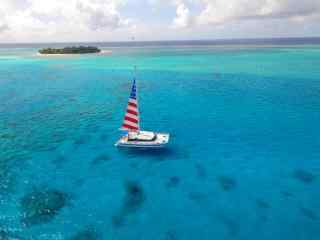 塞班岛海洋图片美国旗帜汽艇图片桌面壁纸